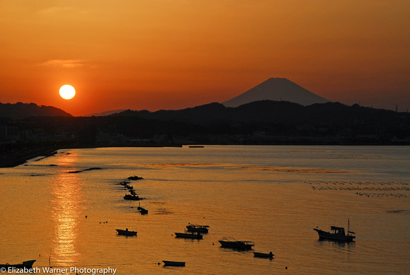 Mt. Fuji forms the backdrop at Sagami Bay at sunset